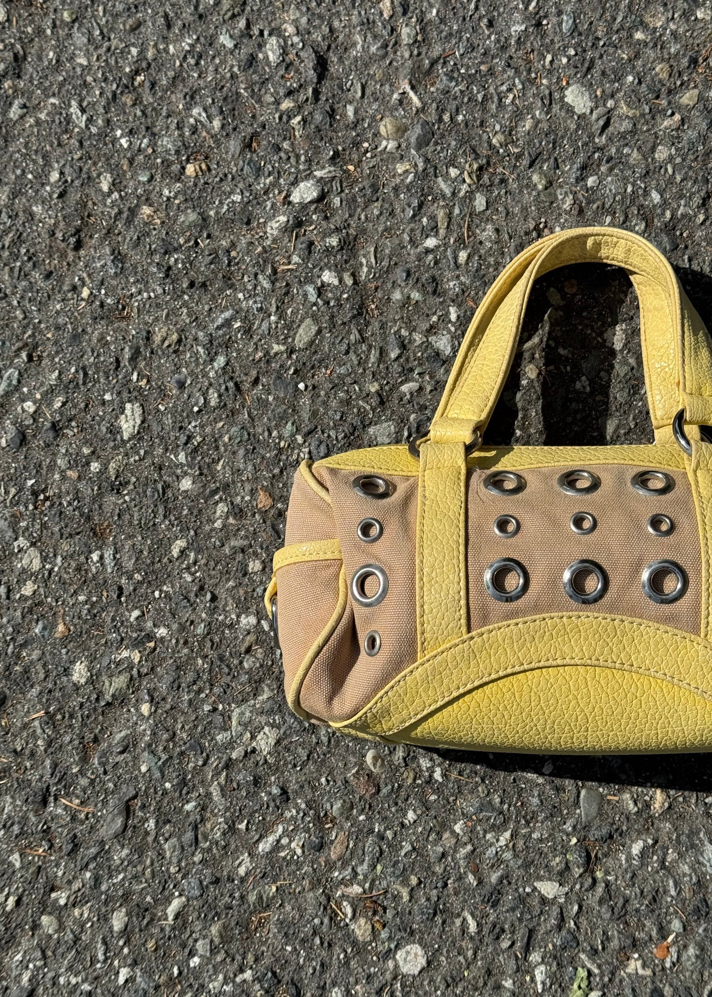 yellow grommet handbag
