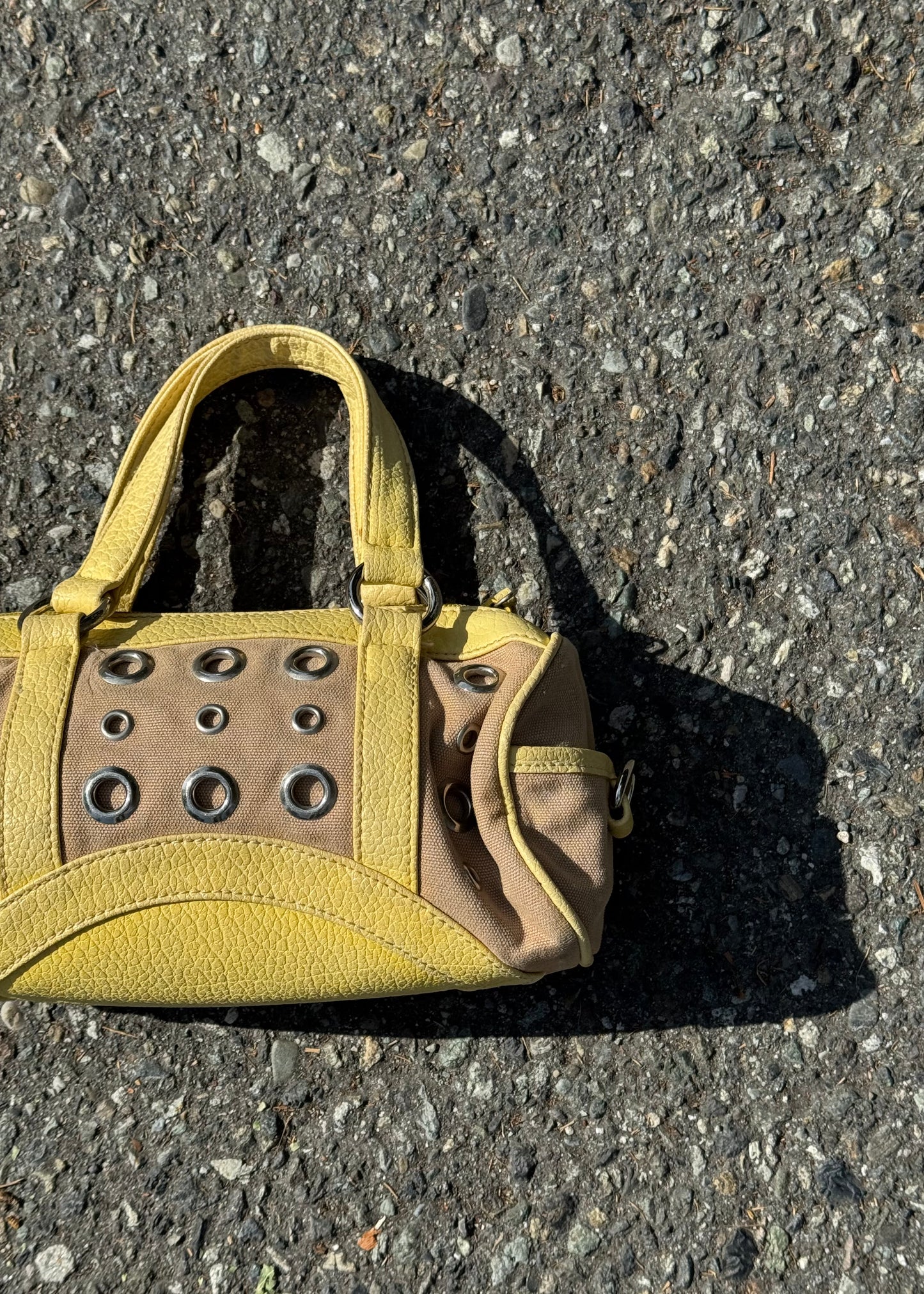 yellow grommet handbag