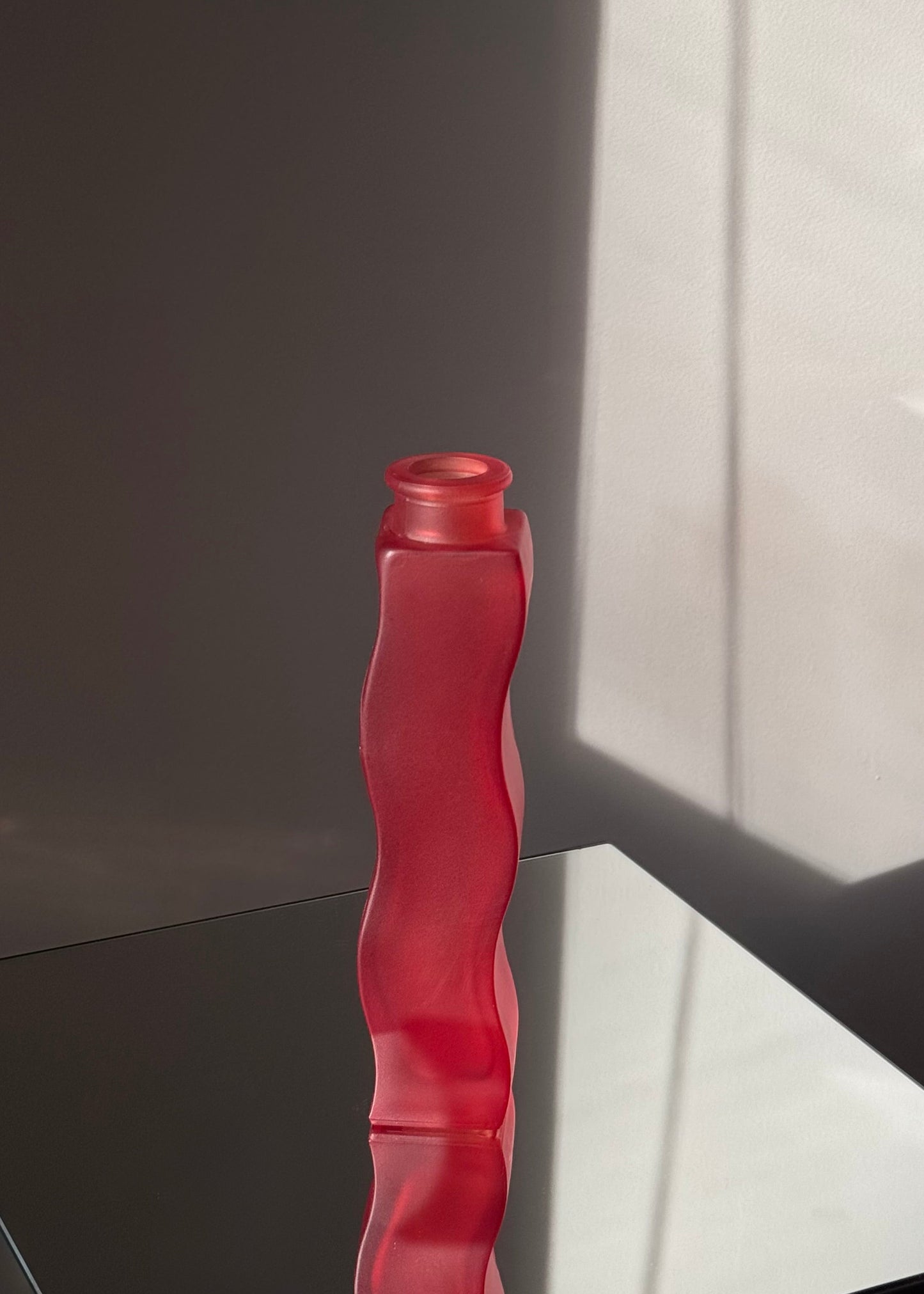 red squiggle vase
