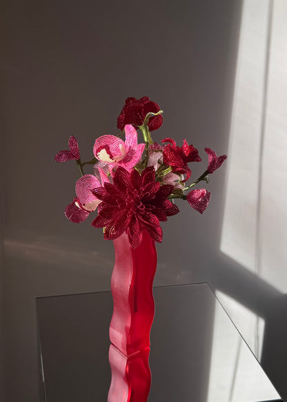 red squiggle vase
